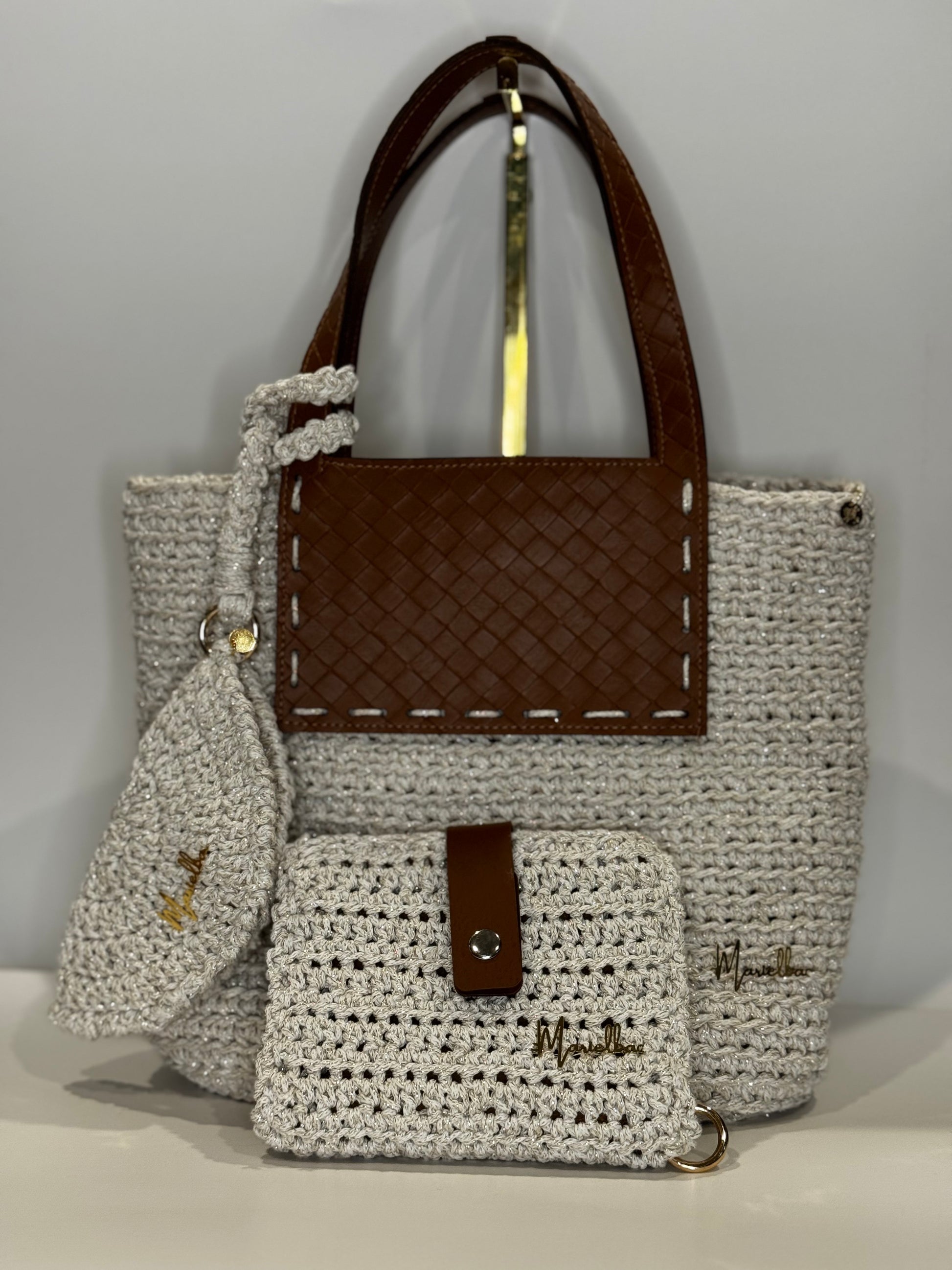 Crochet handbag with wallet and glasses case made with Macrame cord with gold details.